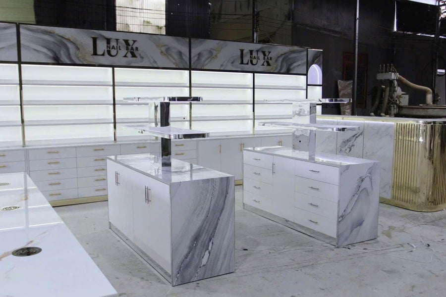 Installed backlit polish display wall with a run of drawer cabinetry, Lux Nail Bar